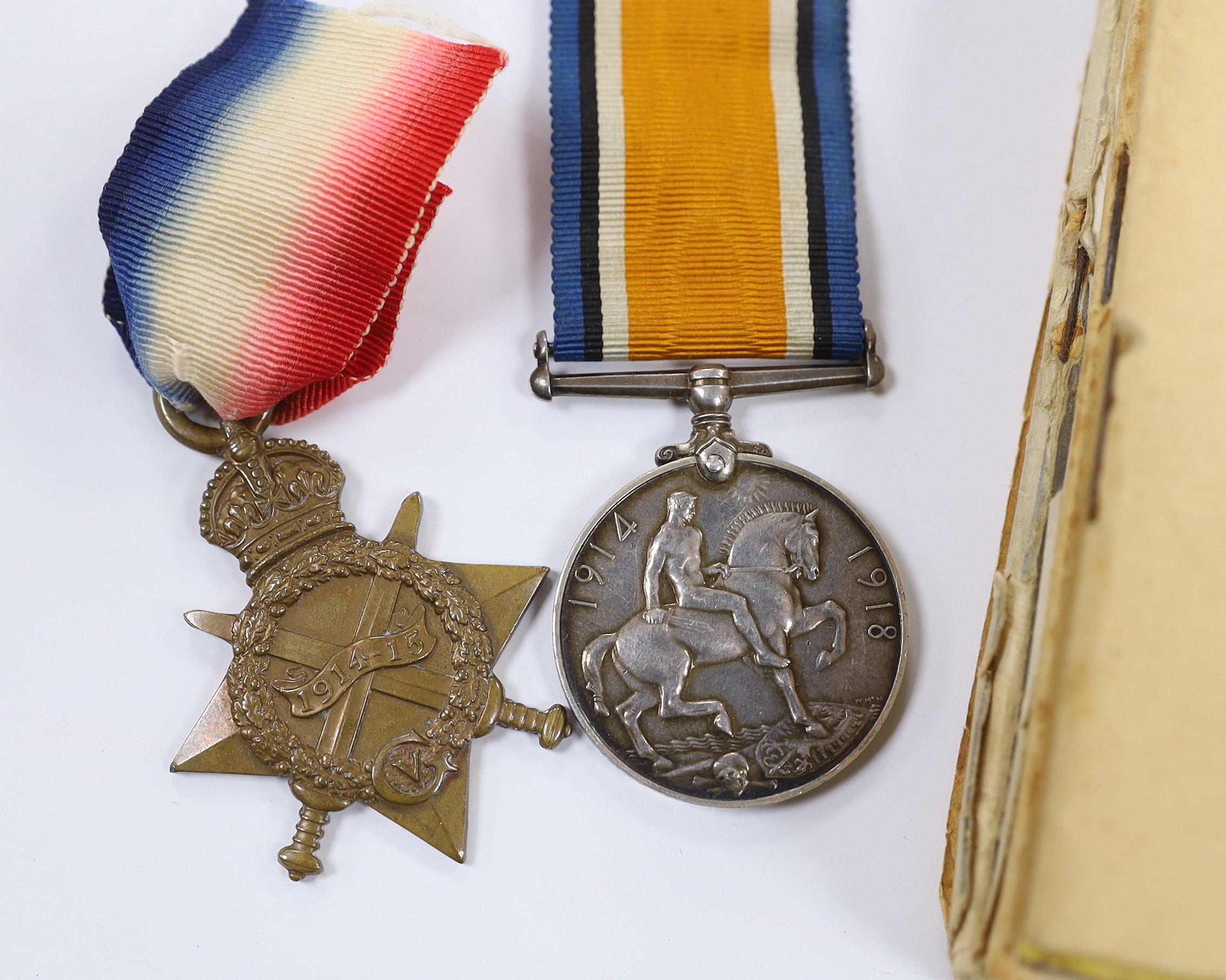 A First World War medal trio to Cpl. E.J. Hannaford, and a small collection of WWII publications including Home Guard instruction booklets, Civil Defence booklets, plus an R.L.S.S. ribbon and a WV badge, etc.